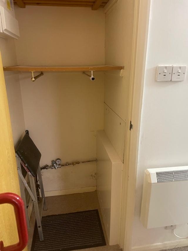 Small internal storage cupboard with a shelf an...