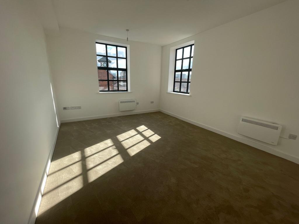 Bright, freshly painted double bedroom with two...