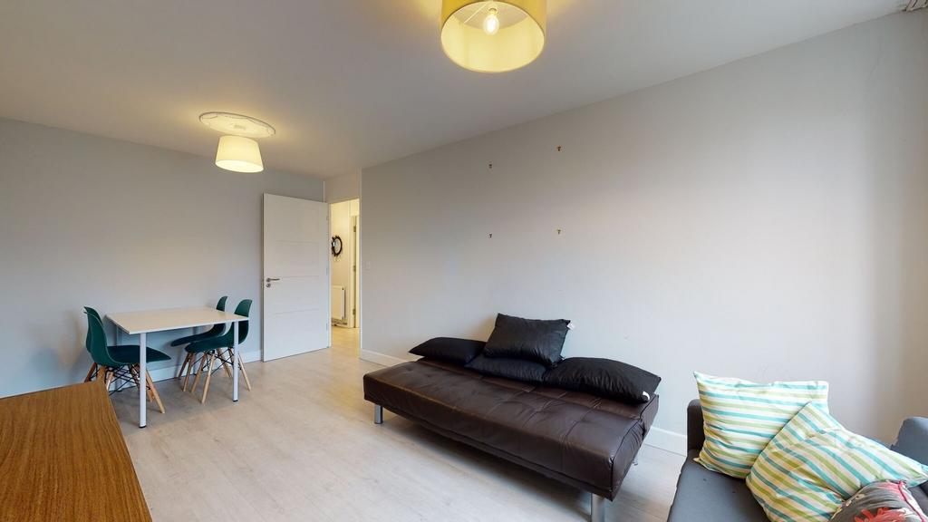 Bright, modern living space with neutral walls,...