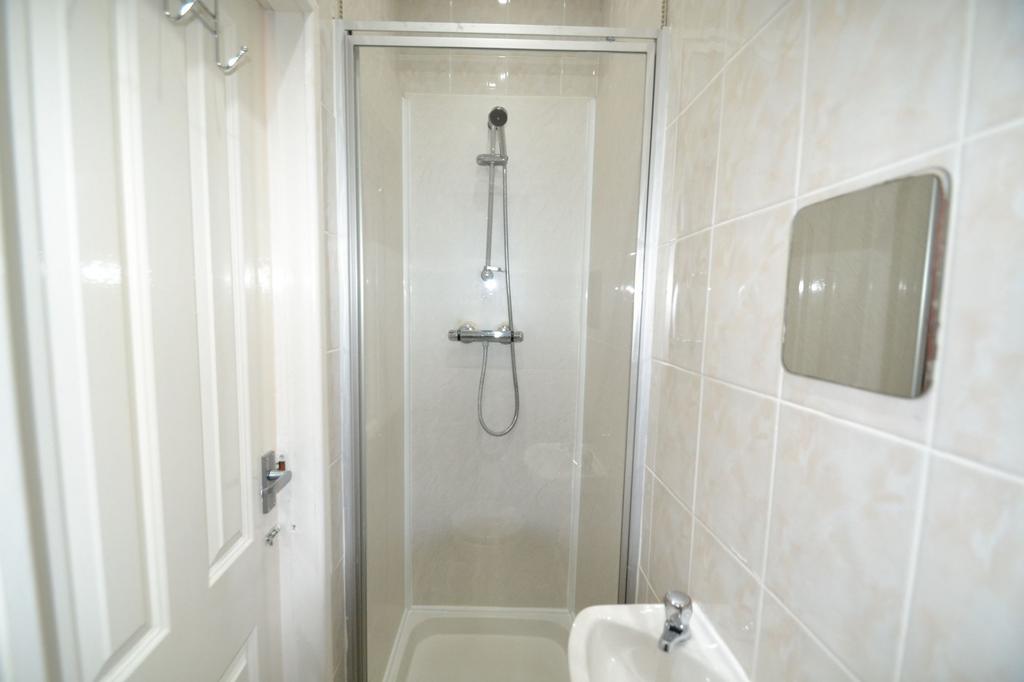 A clean and well-maintained bathroom with a sho...