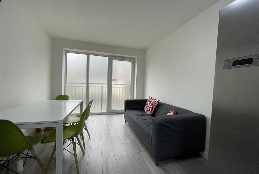 Bright, modern living area with a comfortable d...