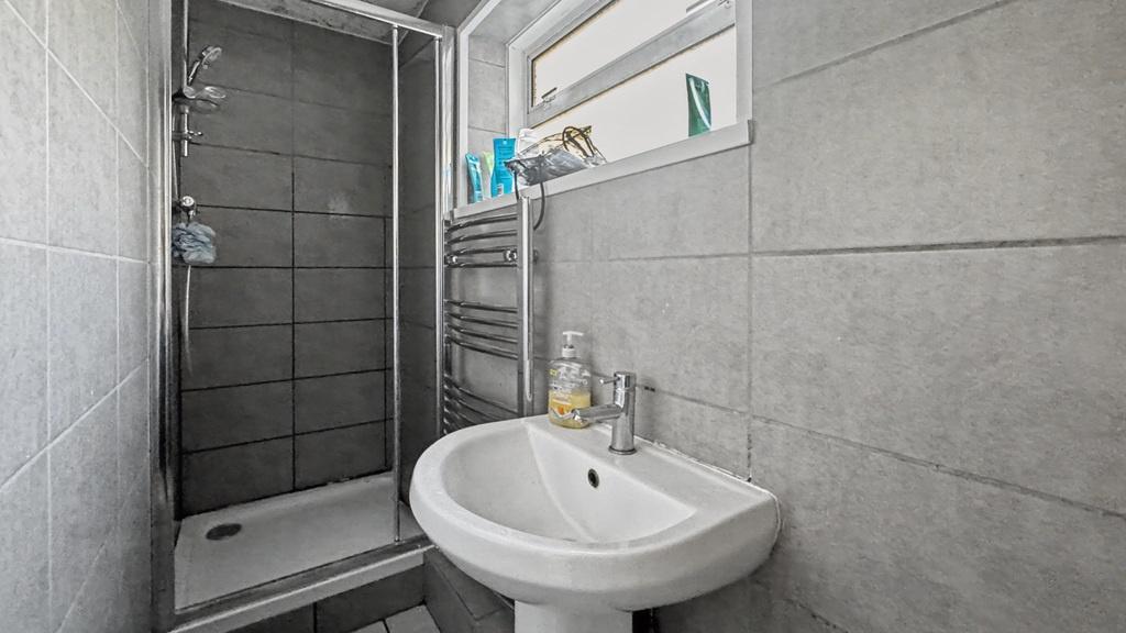Modern tiled bathroom with walk-in shower...