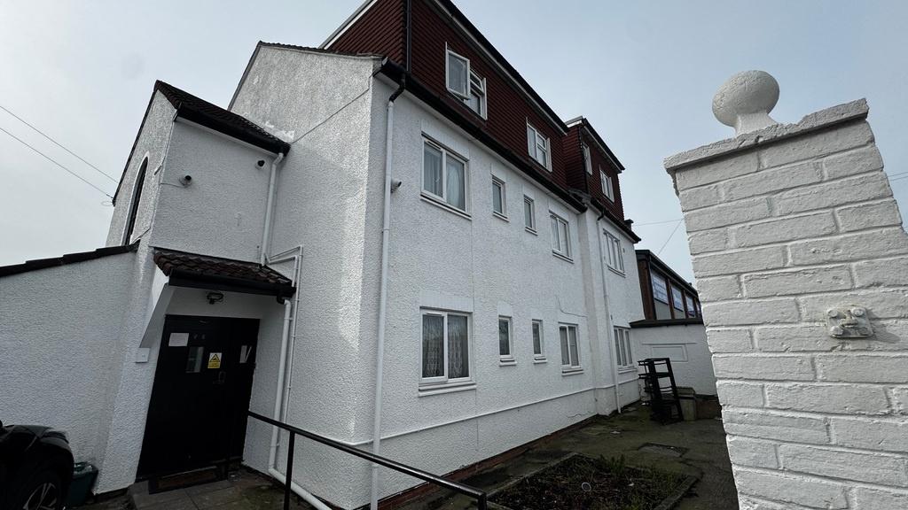 Bright white three-storey terraced property wit...