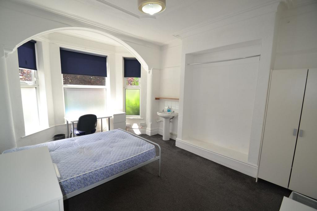 Bright, well-presented bedroom with a large bay...