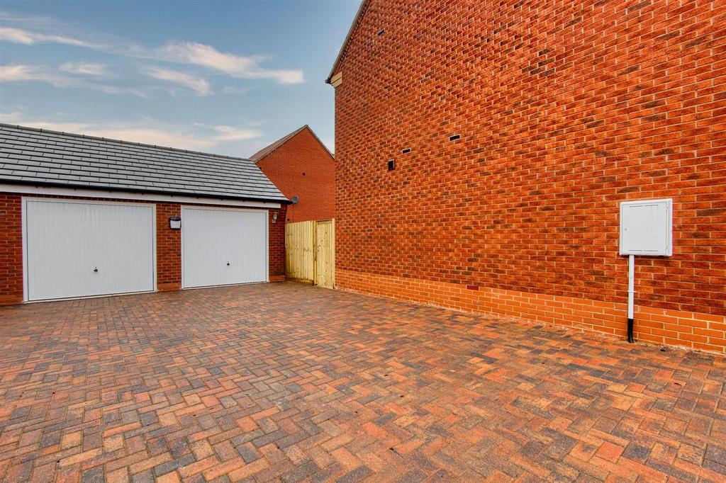 Double garage and driveway