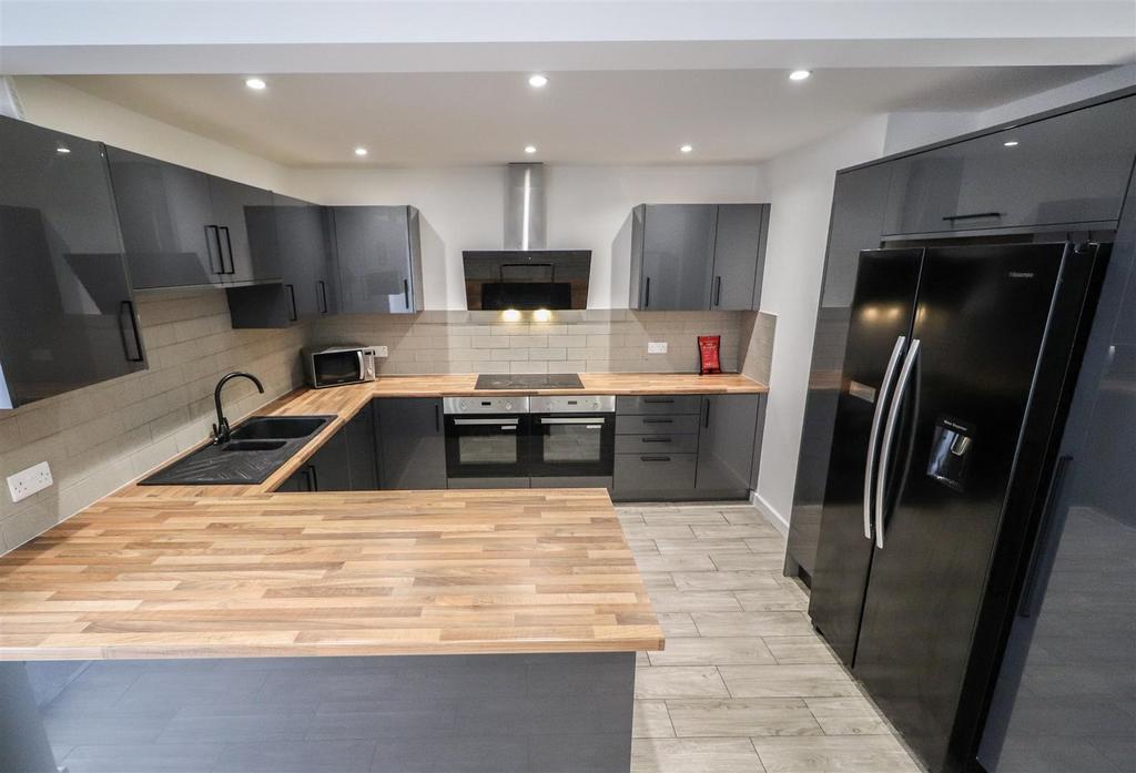 Modern kitchen with island and ample storage...