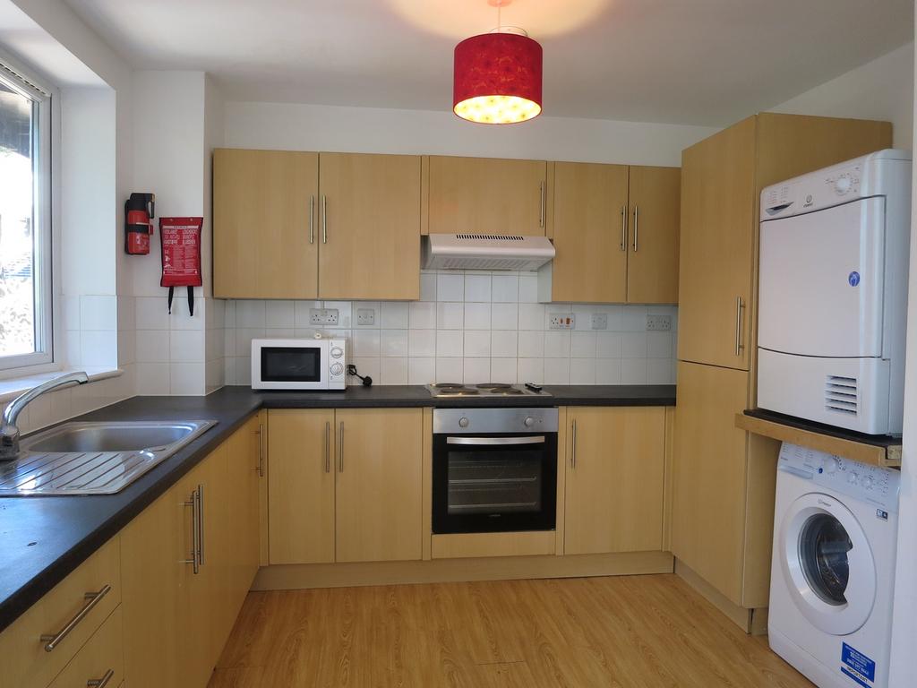 A modern and tidy kitchenette featuring essenti...