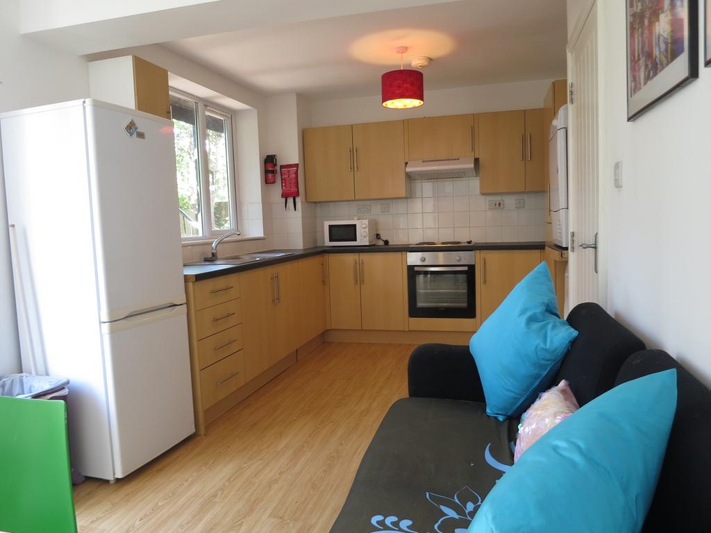 A bright and inviting kitchenette with modern a...