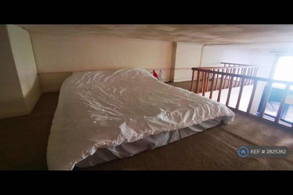 Massive Gallery With Double Bed And Storage Area