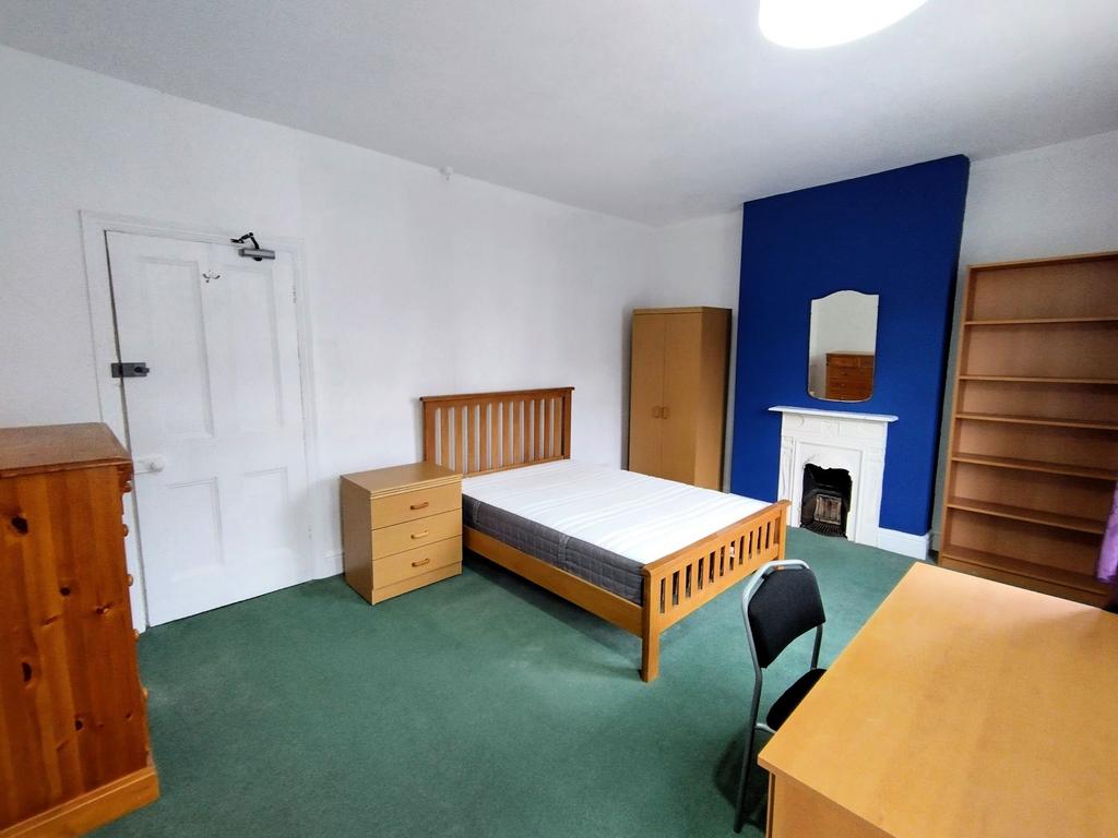 Bright, spacious bedroom with fitted furniture...