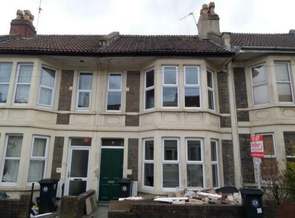 Traditional terraced house with bay windows and...