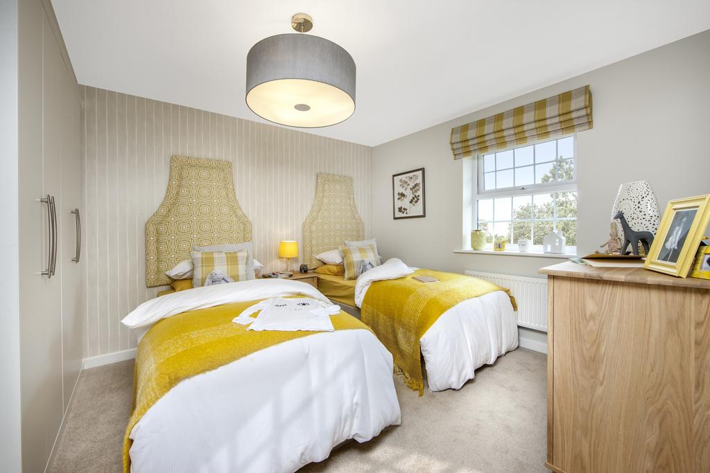 Bedroom with twin beds and wardrobe