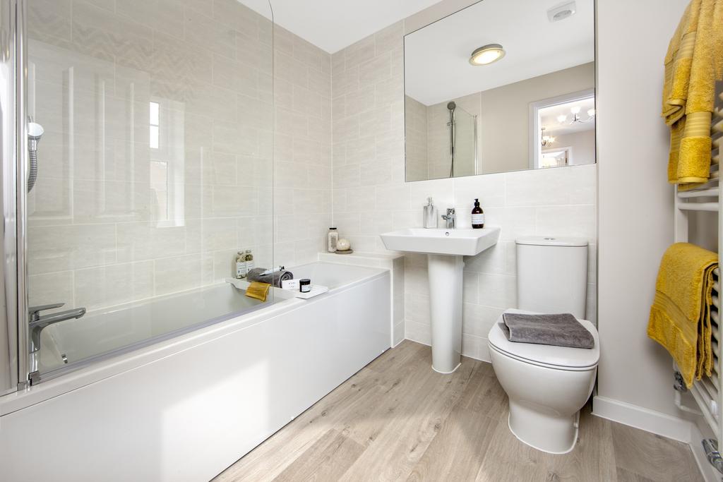 Bathroom with sink toilet and bath