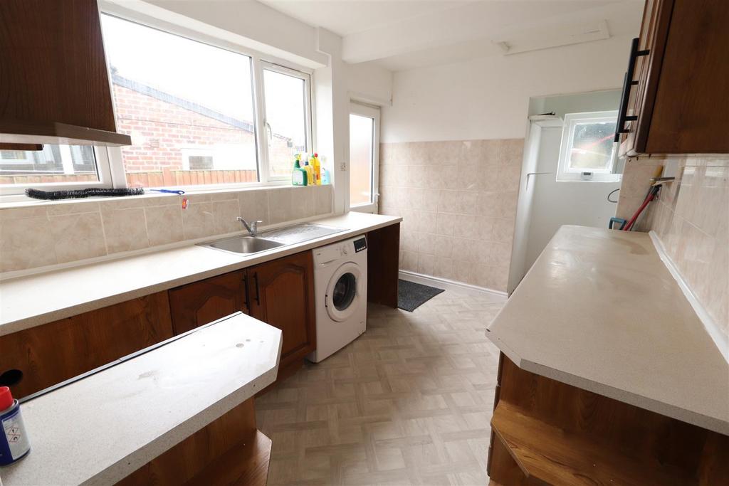 Bright galley kitchen with plenty of counter sp...