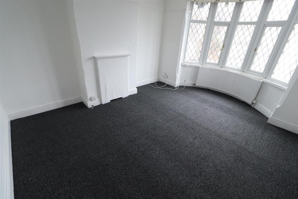 Bright room with large bay window and new carpe...