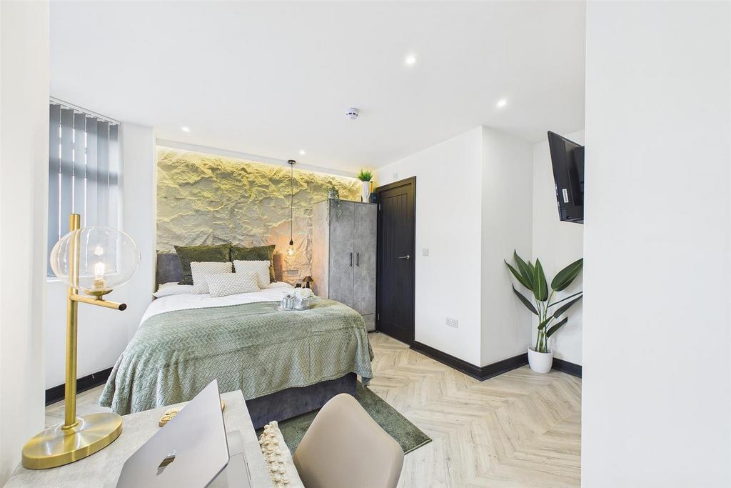 Bright stylish bedroom with feature wall...