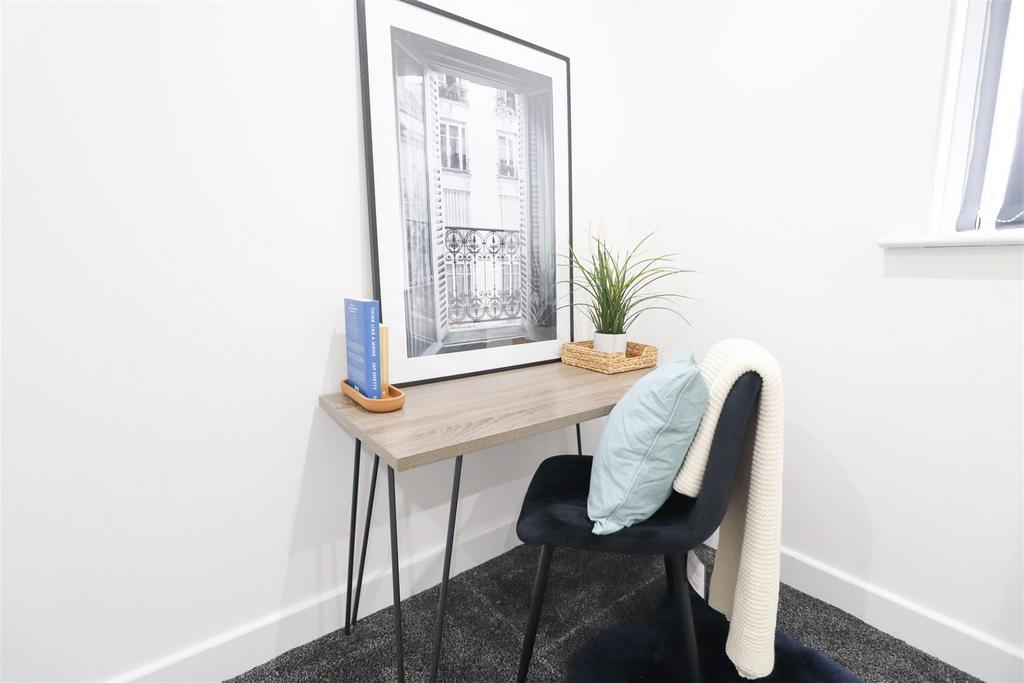 Bright workspace with desk, chair and décor...