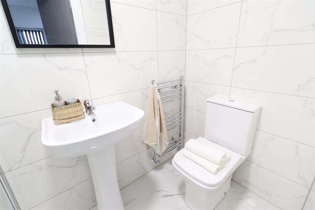 Bright modern bathroom with clean white tiles...