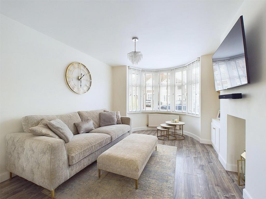 Bright, modern living room with a comfortable L...