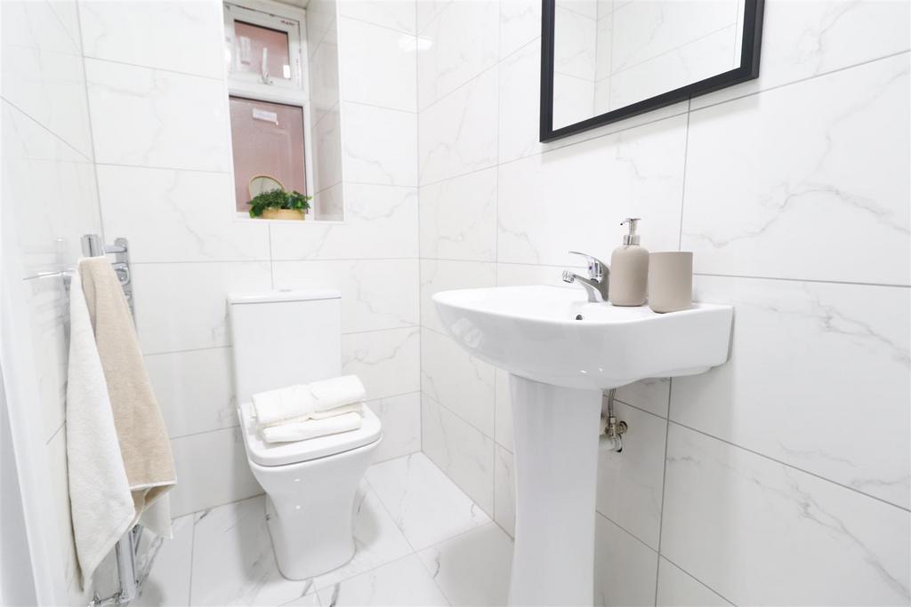 Bright modern white bathroom with clean fixture...