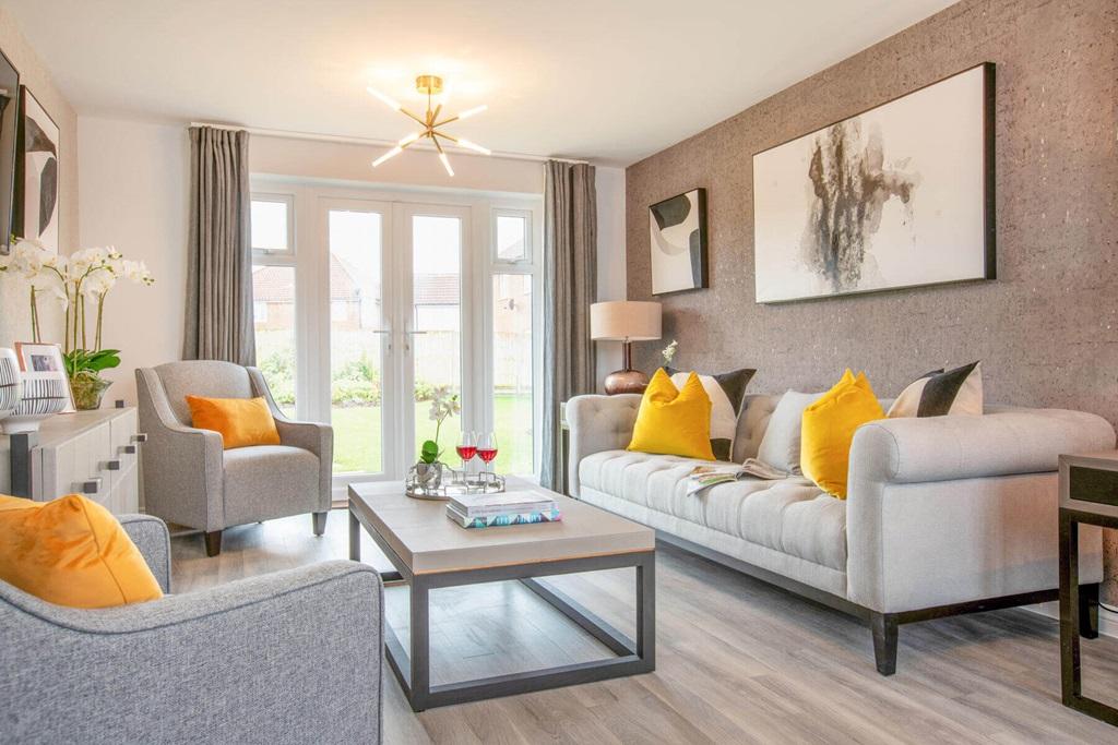 A bright and airy lounge features double doors...
