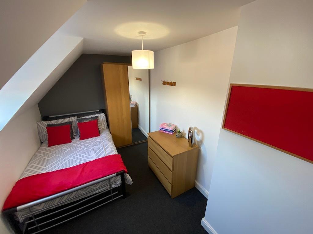 Bright, neatly presented bedroom with a double ...