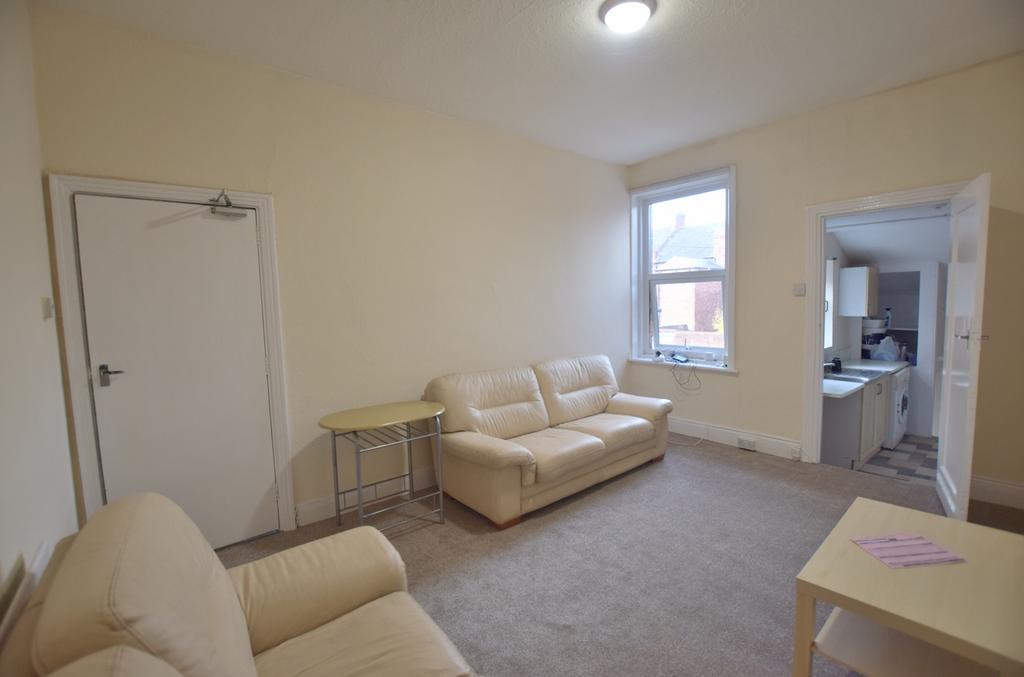 Spacious living room featuring comfortable seat...