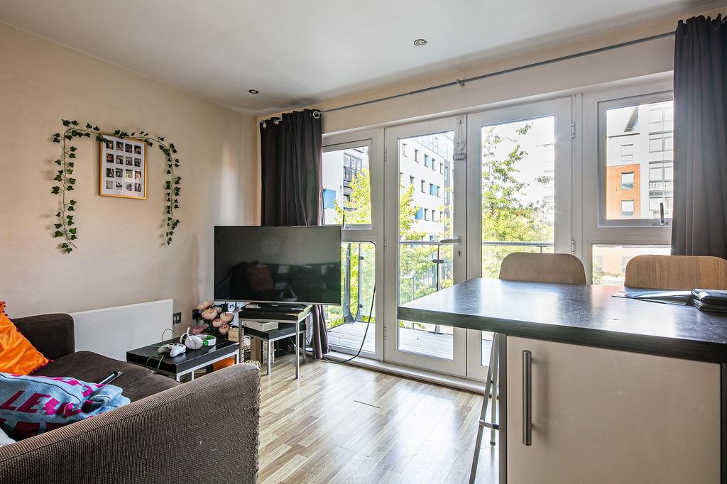 Bright, modern living area with large floor-to-...