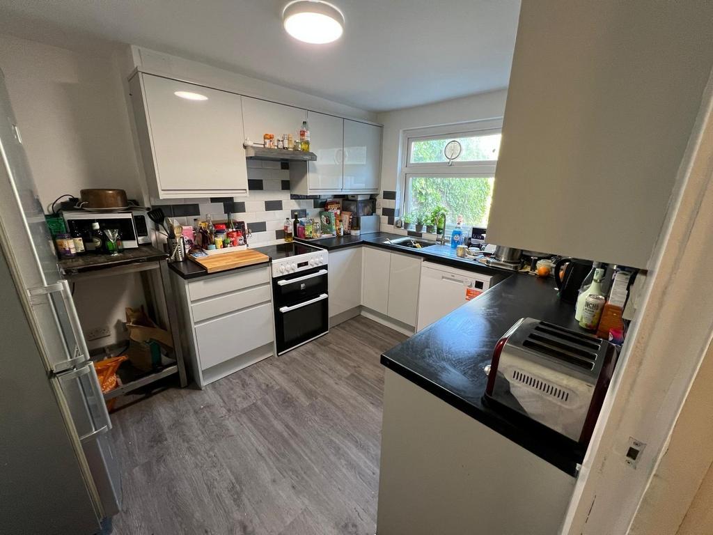 Bright and modern kitchen with ample counter sp...