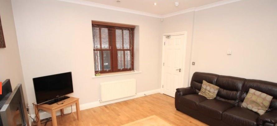 Well-presented living room with wood flooring, ...