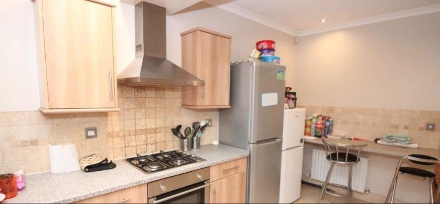 Well-equipped kitchen with modern appliances, s...