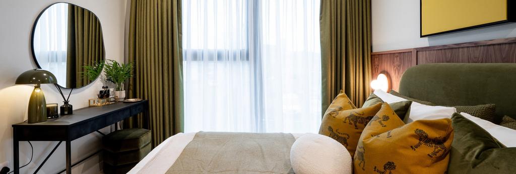 Closeup photo of double bed and window with...