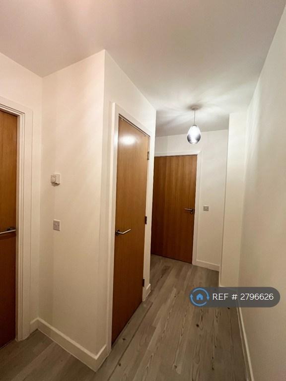 Hallway With Two Storage Cupboards