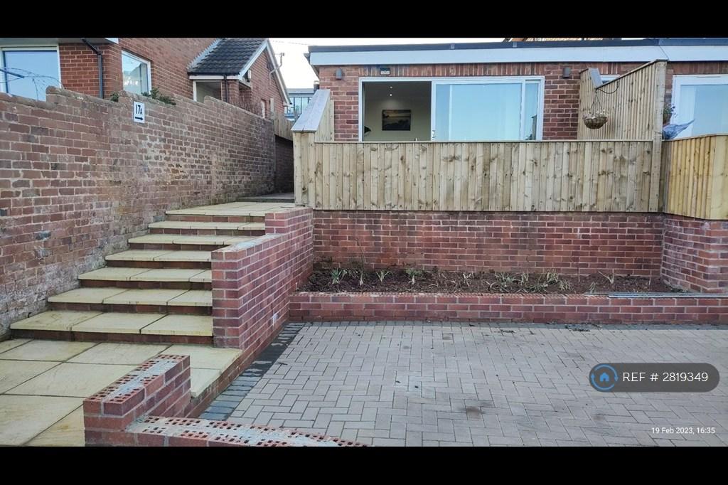 Parking Space &amp; Steps Leading To Both Entrances