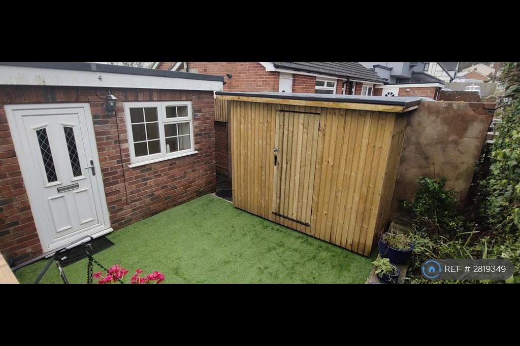 Front Patio Area With Storage Shed