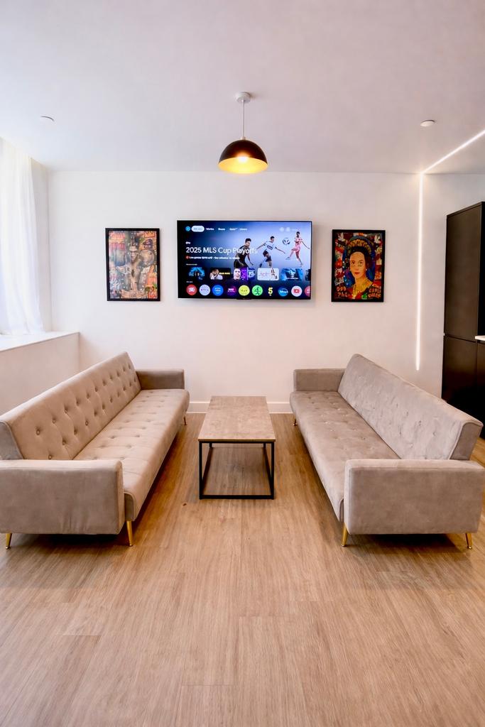 Contemporary lounge with sofas and wall TV...