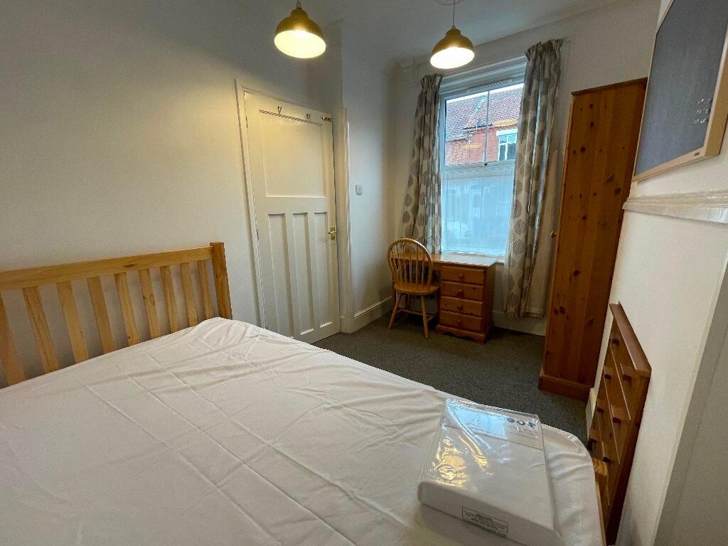 Bright, neatly presented bedroom with a double ...