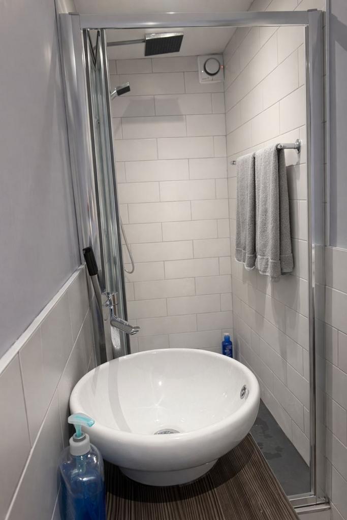 Compact modern bathroom with stylish basin and ...