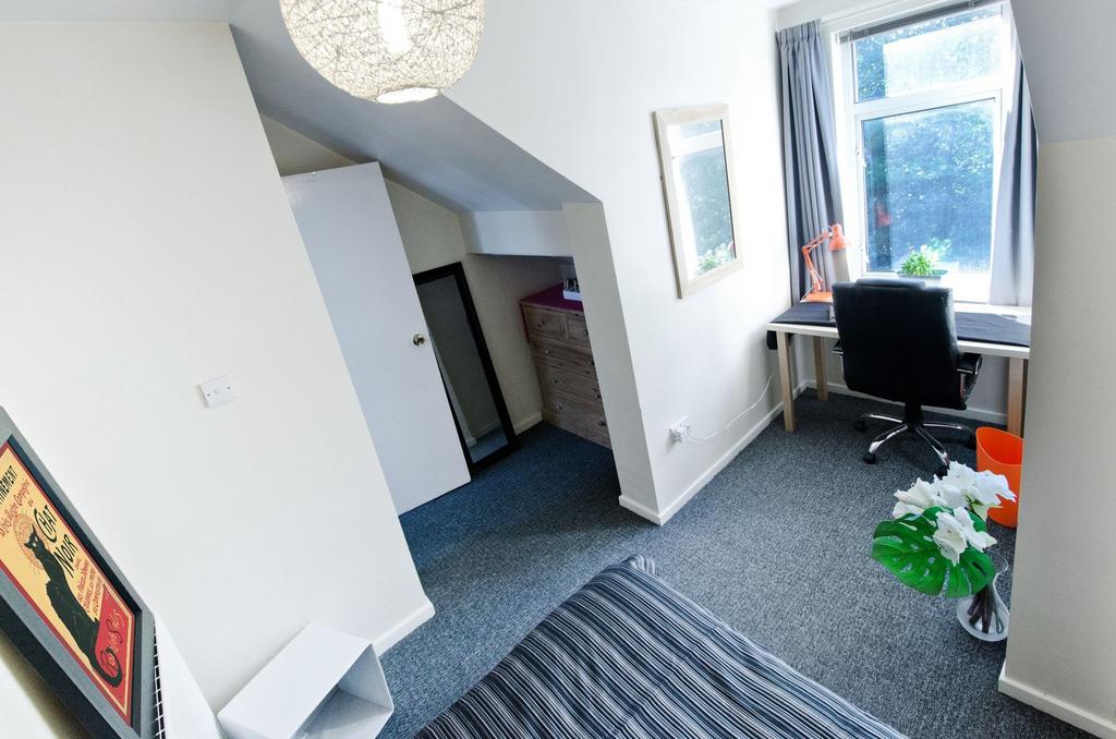 Bright, neatly presented bedroom with a large w...