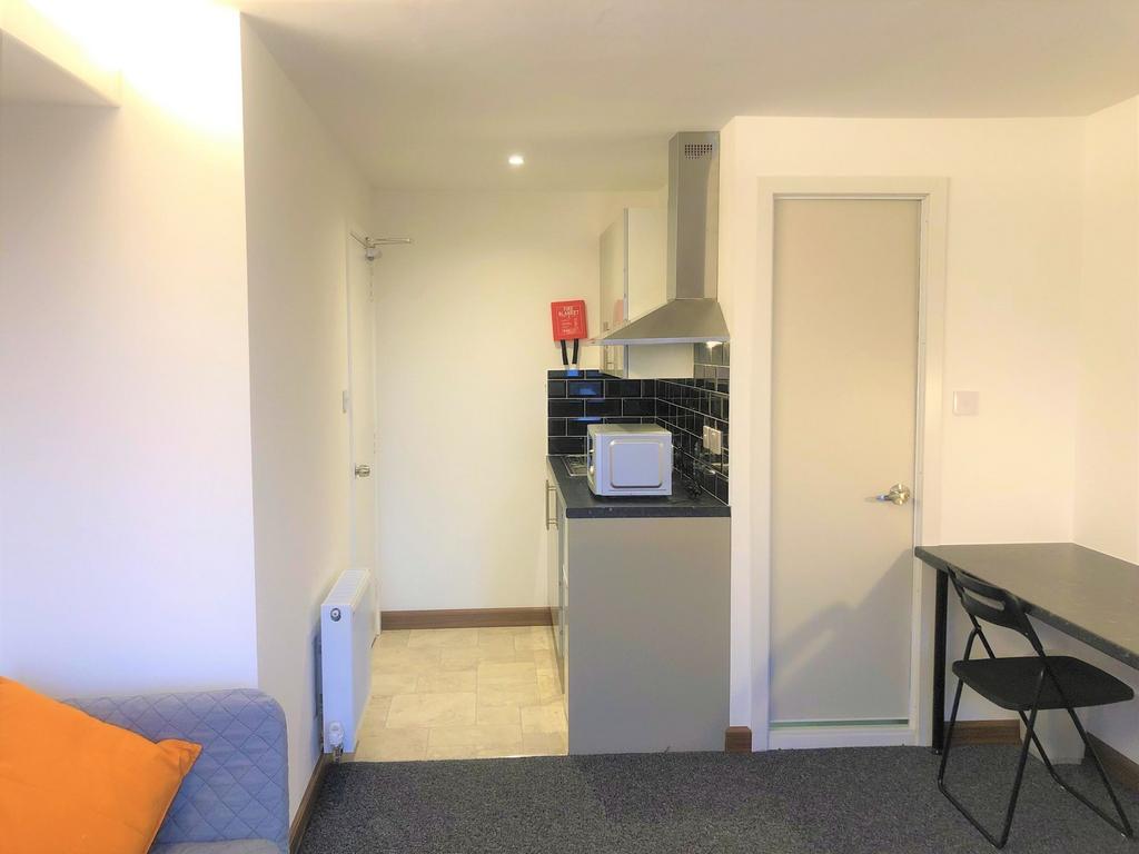 A compact, well-maintained kitchen area with mo...