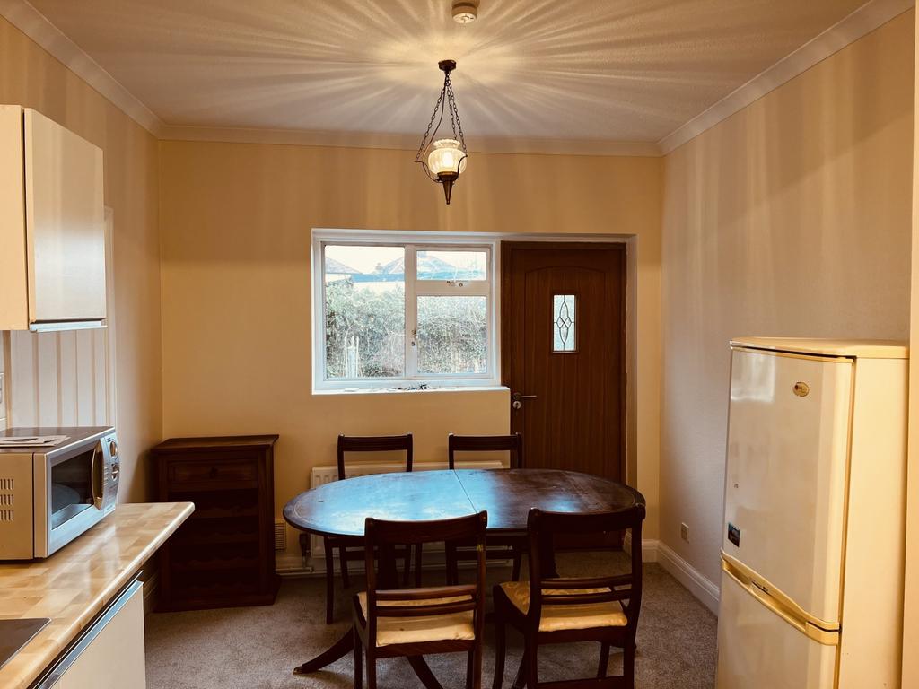 Bright, neutrally decorated kitchen/dining area...