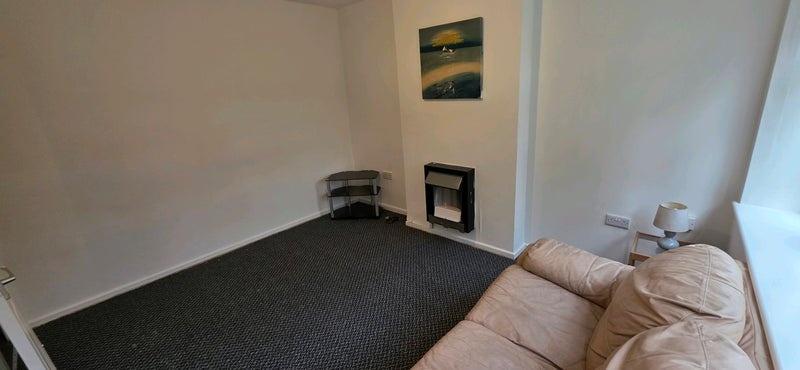 Compact living room with a neutral colour palet...