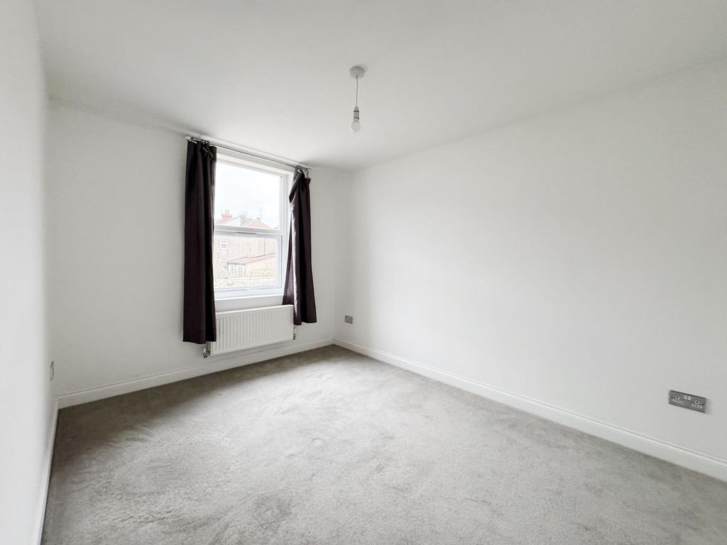 Bright, recently redecorated bedroom with neutr...