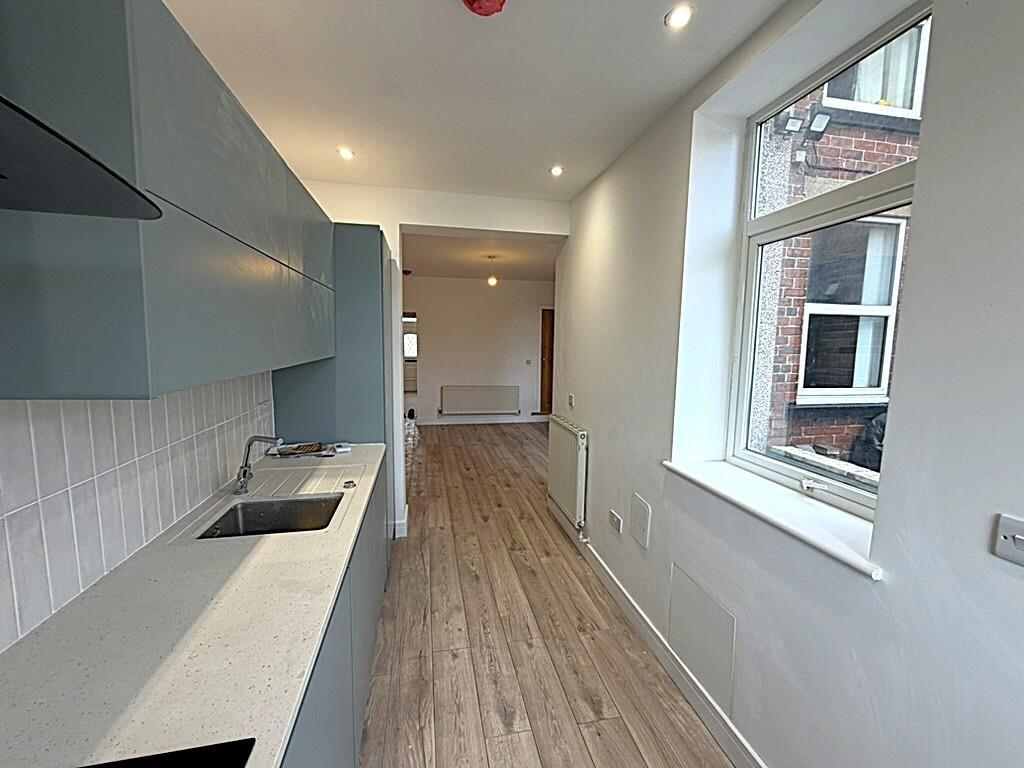 Bright modern galley kitchen with good storage...