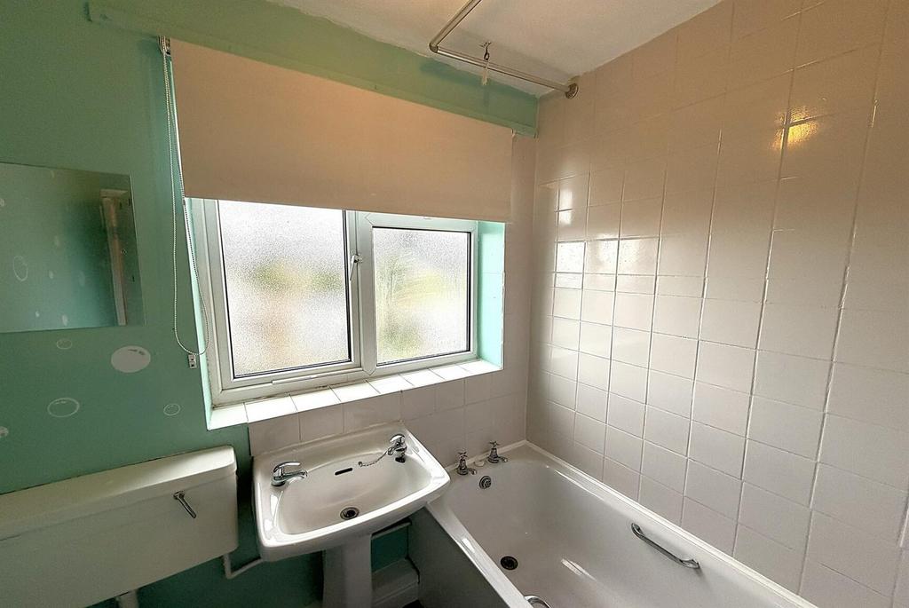 Bright bathroom with bathtub and sink...