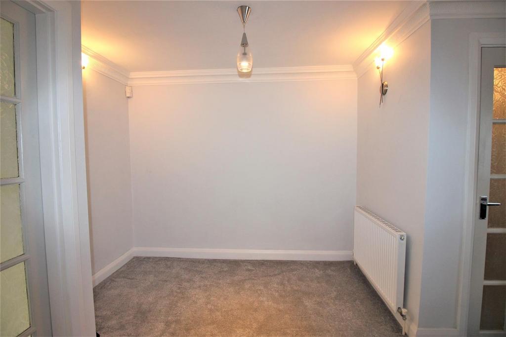 Bright neutral hallway with simple décor...
