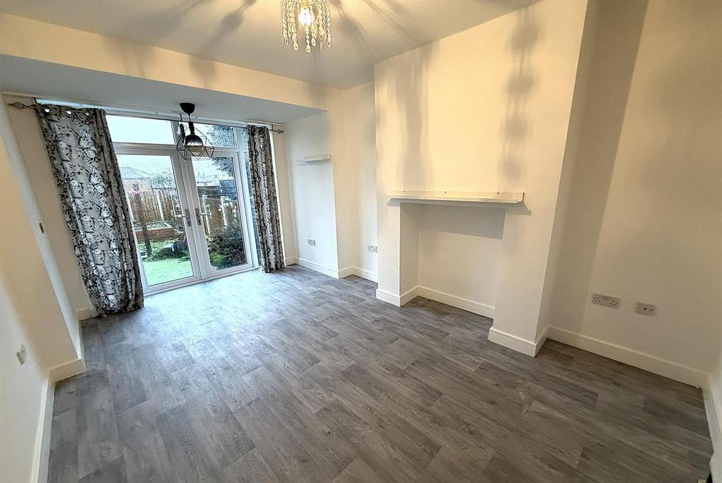 Bright living room with patio doors and modern ...