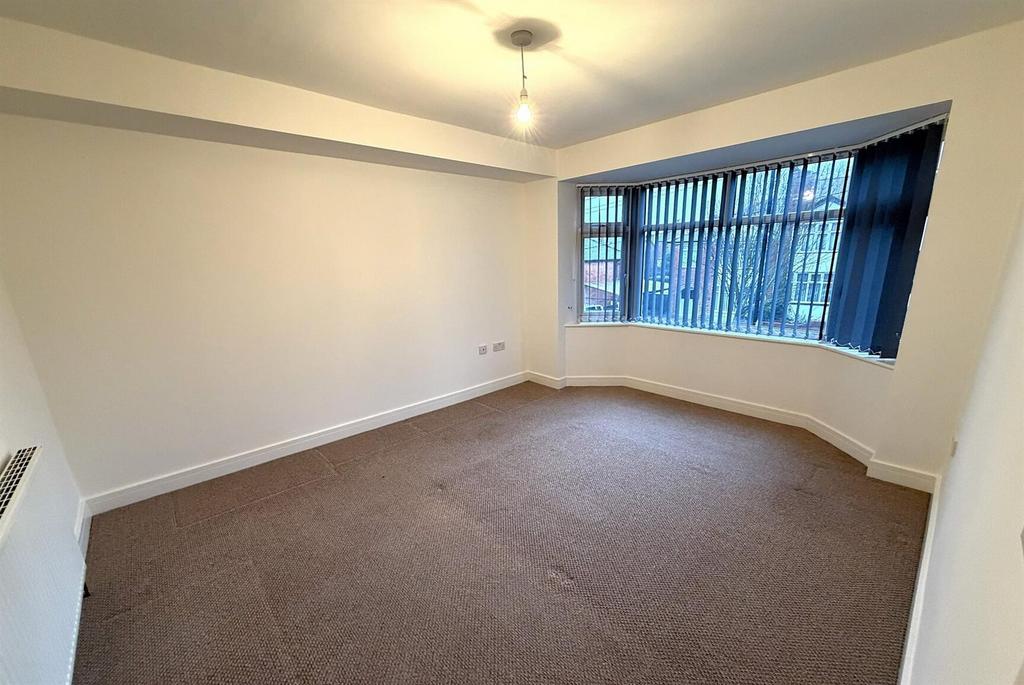 Bright double bedroom with bay window...