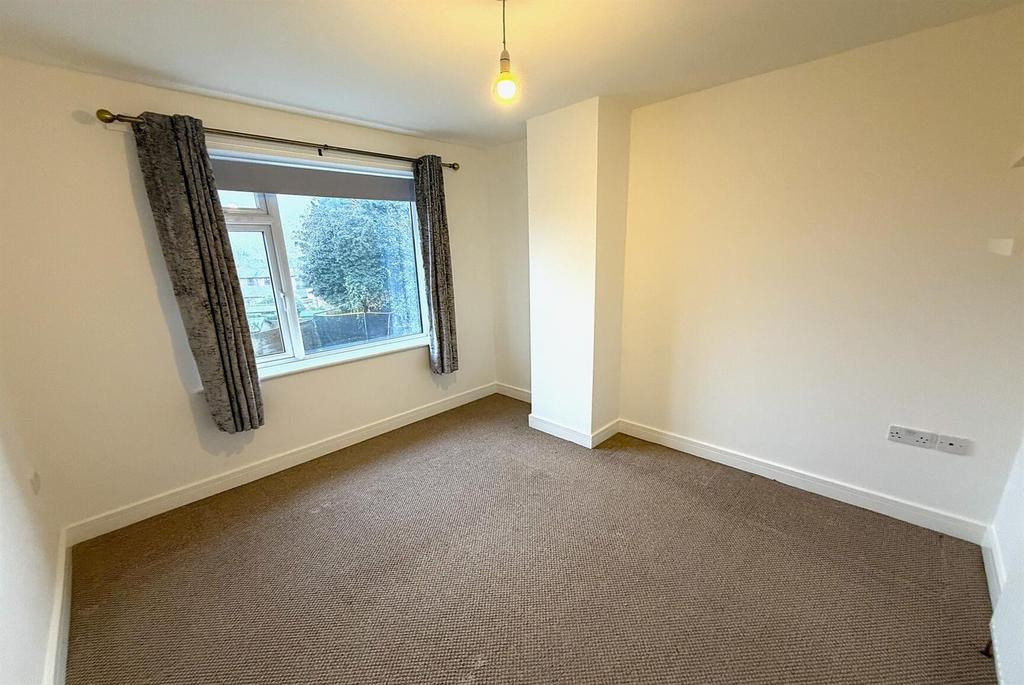 Bright double bedroom with large window...