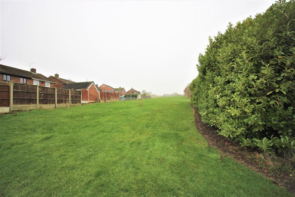 Spacious private lawn with mature hedging...
